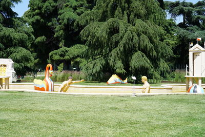 People relaxing in swimming pool at park