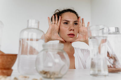 Portrait of woman drinking bottles