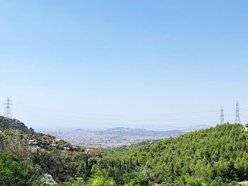 Scenic view of landscape against clear blue sky