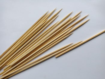 High angle view of corn on table against white background