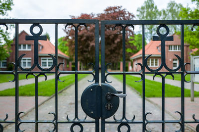 Closed gate against houses