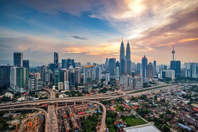 High angle shot of cityscape against the sky