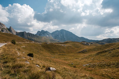 Scenic view of landscape and mountains against sky