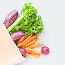 High angle view of chopped vegetables against white background