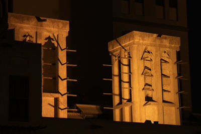 Low angle view of illuminated building at night