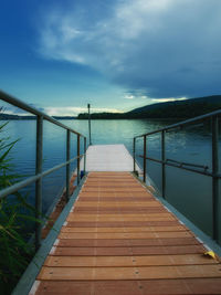 Pier over sea against sky