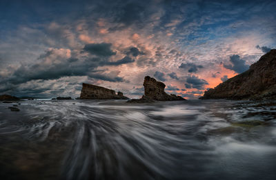 Scenic view of sea against sky at sunset