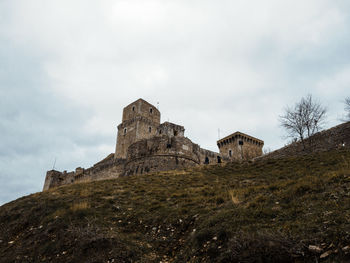 Low angle view of historic building against sky