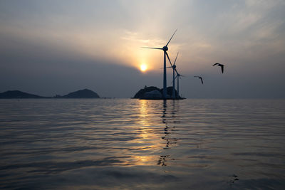Scenic view of sea against sky during sunset