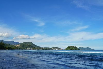 Scenic view of sea against blue sky