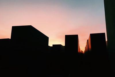 Low angle view of buildings at sunset