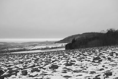 Scenic view of snow covered landscape against clear sky