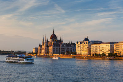 Evening view of hungarian parliament from the chain bridge in budapest