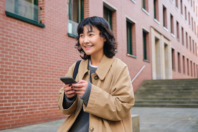 Young woman using mobile phone