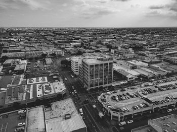 High angle view of buildings in city against sky