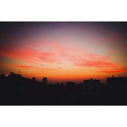 Silhouette of building at sunset