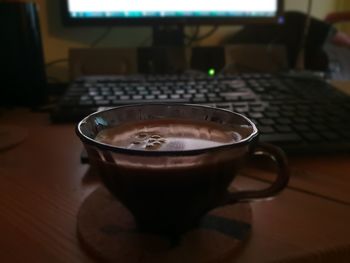 Close-up of coffee cup on table