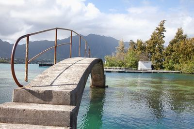 Close-up of footbridge by sea