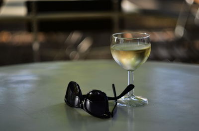 Close-up of wine glasses on table