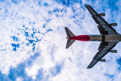 Directly below shot of airplane flying in sky