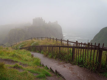 Scenic view of sea against sky during foggy weather