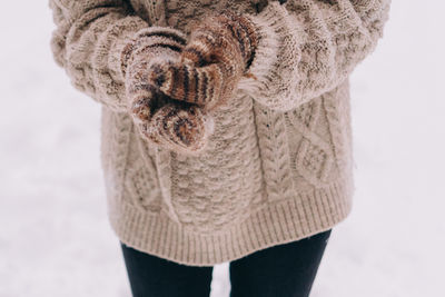 Young woman having fun in the snow