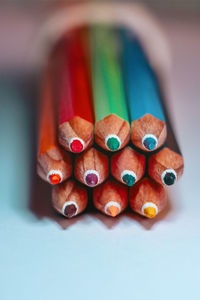 Close-up of multi colored pencils on table