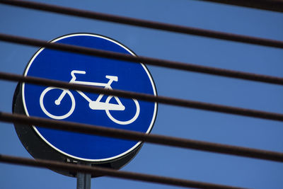 View of bicycle sign against sky