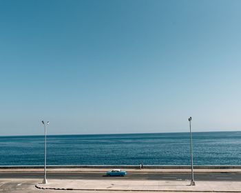 Scenic view of sea against clear blue sky