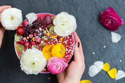 High angle view of hand holding rose bouquet