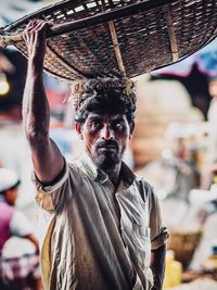 Portrait of man with umbrella