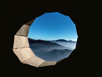 Monte tamaro against sky seen from window