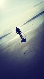 Woman standing on beach