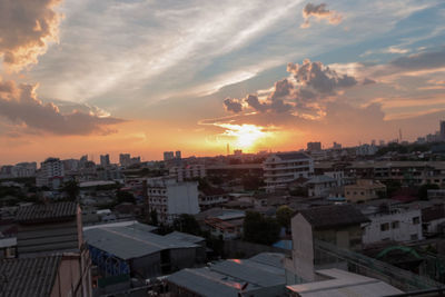 High angle view of buildings against sky during sunset