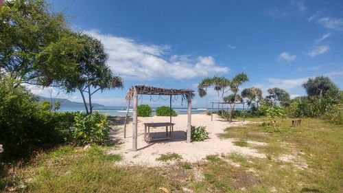 Built structure on beach against sky