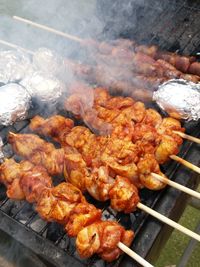 High angle view of meat on barbecue grill