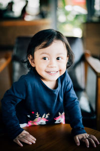 Portrait of smiling boy at home
