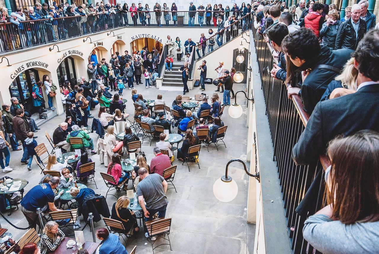 HIGH ANGLE VIEW OF PEOPLE ON STREET