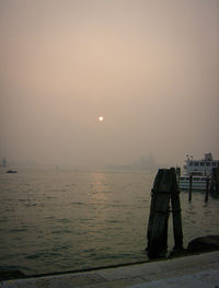 Scenic view of sea against sky at sunset