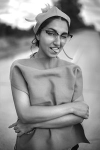 Portrait of smiling young woman standing outdoors