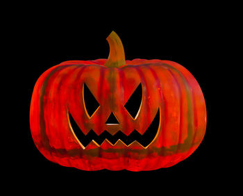 Close-up of illuminated lantern against black background