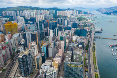 High angle view of modern buildings in city against sky