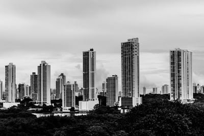 Buildings in city against sky