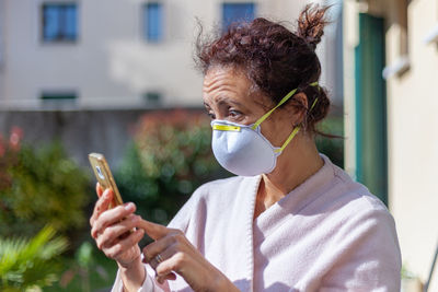 Mature woman using mobile phone