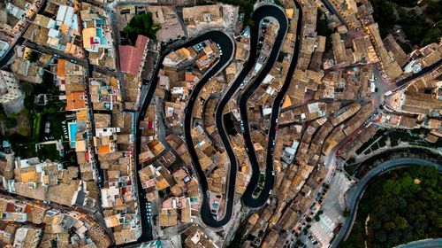 Aerial view of road and houses in city