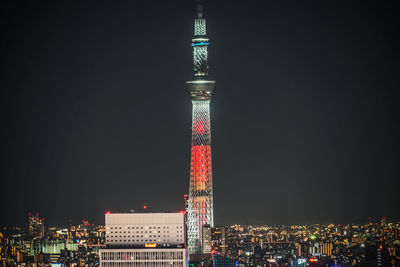 Illuminated buildings in city at night