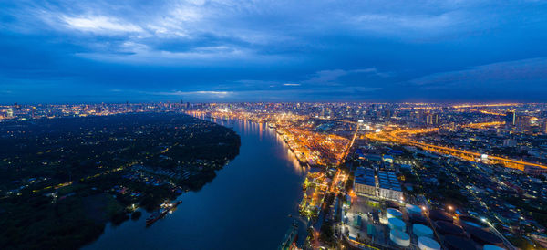 High angle view of illuminated buildings in city at night