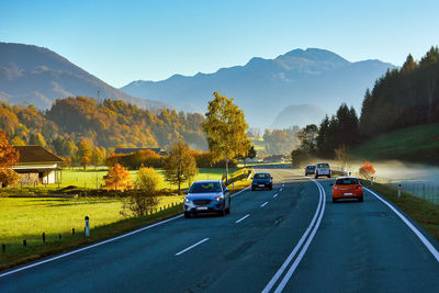 Cars on road against sky