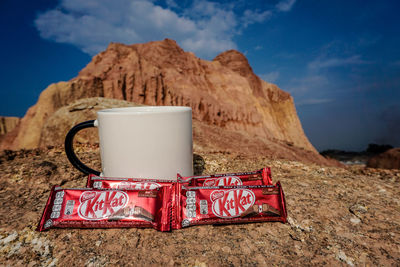 Close-up of tea cup on rock
