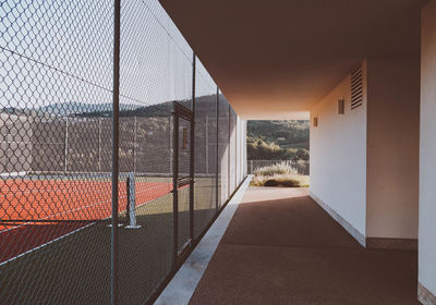 Corridor of building against sky